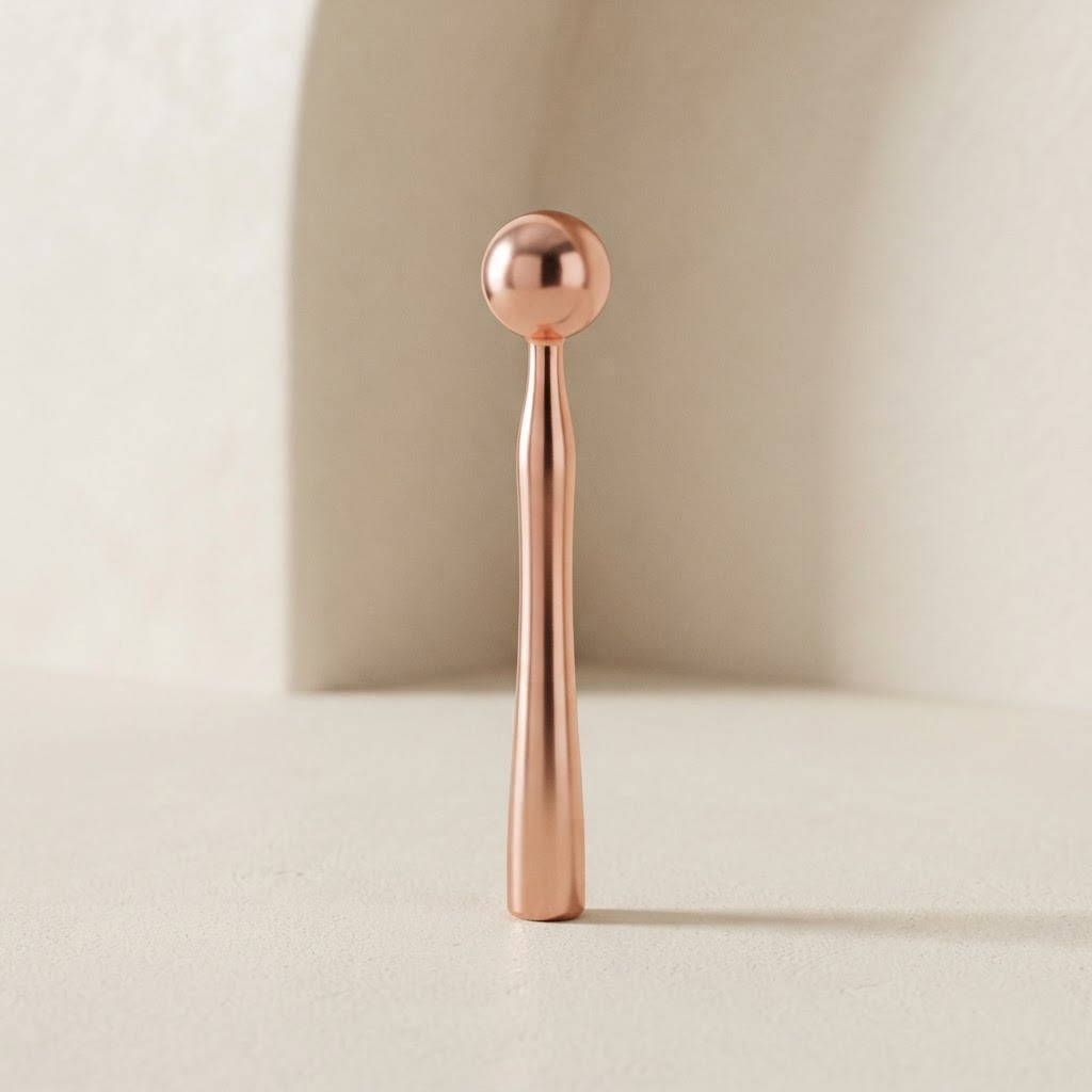 Rouleau de massage facial en métal cuivre rosé poli